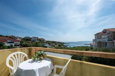 Image de Appartement d'une chambre avec la terrasse et la vue sur le mer Jakisnica, Pag (A-4053-c)