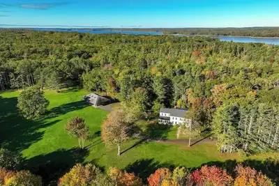 Image de Renovated farmhouse on an acreage with grill, four-bedrooms, & W/D - river views