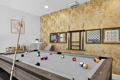 Image de Luxury Tropical Oasis Saltwater Pool + Game Room