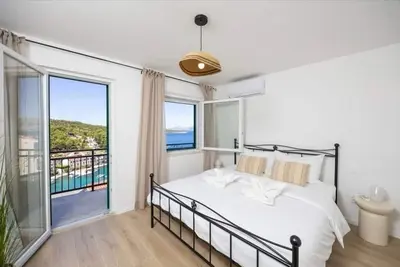 Image de Appartement de deux chambres avec le balcon et la vue sur le mer Povlja, Brac (A-25517-a)