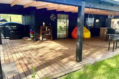 Image de Fresh and new cabin house with large teracce under roof + hot tube.