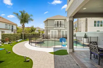 Image de The Corolla Manor at Reunion | 6br Orlando villa w/ pool, game room & theater near Disney