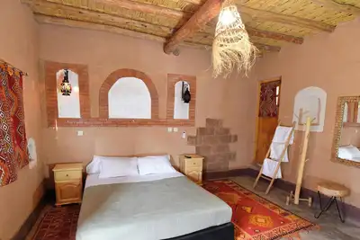 Image de chambre avec terrasse privée dans une ferme au cour de la palmerais