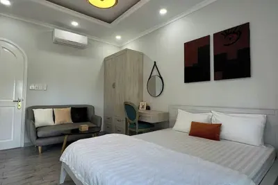 Image de Soc Nhim Homestay Grandworld Phu Quoc Room 101 Triple Balcony Beach