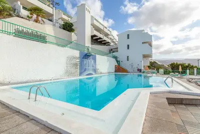 Image de Appartement de vacances 'Paraíso Para Todos' avec vue sur mer, piscine et Wi-Fi