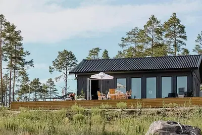 Image de Chalet avec vue sur la mer et terrasse proche de la nature