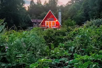 Image de Chalet rouge au bord du lac à Bjärnum