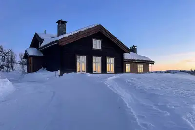 Image de Charmante cabane en rondins avec luxe moderne