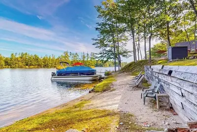 Image de Stunning lakefront home with private dock, deck, firepit, and lake view