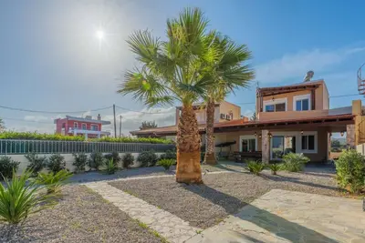 Image de Palmview Villa One minute on foot away from an almost private beach! ! !