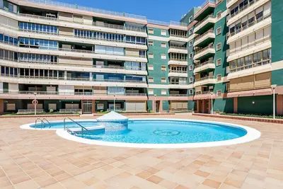 Image de Appartement « Entero Playa Perello » avec piscine partagée, Wi-Fi et climatisation