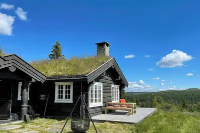 Image de Cabane en rondins avec vue sur le lac Svansettjønni