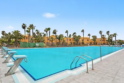 Image de Appartement de vacances « Oasis Papagayo Cozy Patio » avec piscine partagée, terrasse privée et Wi-Fi