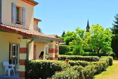 Image de Appart attenant au parc aquatique | Jardin privé