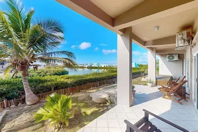 Image de Vibrant, colorful lagoon-front suite with pool access, scenic patio, & W/D