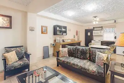 Image de Homey suite in town w/ WiFi, partial Ac, shared pool & veranda - walk to beach