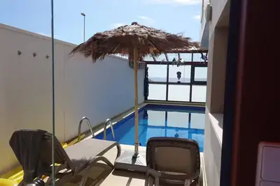 Image de Designer home with a heated (covered) pool