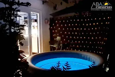 Image de Apartment with independent entrance, covered patio, outdoor jacuzzi and garden