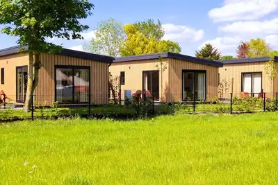 Image de Escape to the tranquility of the Veluwe in this new and cozy 4-person chalet with hot tub (Softub) in Hulshorst where your pet is also welcome.