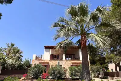 Image de Villa Vista Mondragó – Villa paisible avec jardin, terrasses et vue mer à Portopetro