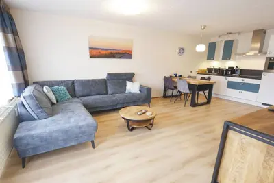 Image de Modern apartment for up to 4 guests beside the dunes of Callantsoog. Enjoy a terrace with dune views, a luxury bathroom with shower and bathtub, and two bedrooms, including one with a double sofa bed.