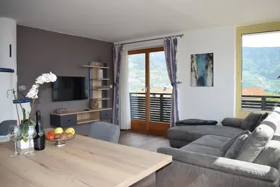 Image de Appartement 'Residence Ladurn Erde' avec vue sur la montagne, terrasse privée et Wi-Fi
