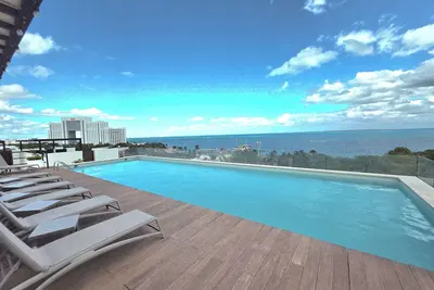 Image de Charmant condo 2 chambres & toit-terrasse vue océan & face à la plage