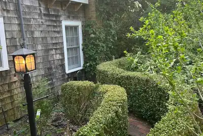 Image de Historic 1932 Cherry Grove Beach House - Gardens, Sun and steps to the Beach.