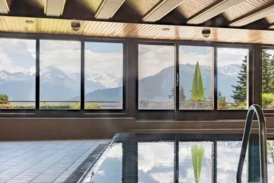 Image de Studio cosy • Piscine • Vue Alpes • Crans-Montana