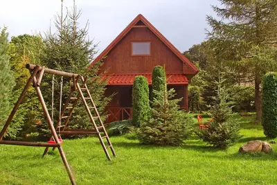 Image de Maison de vacances traditionnelle avec cheminée à Kopalino