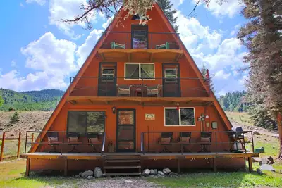 Image de \"The Texas Tipi\" sur la rivière, Grand groupe \/ Famille, Cheminée suspendue