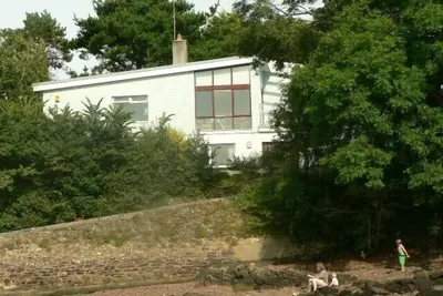 Image de Secluded beachside 4 bed house, family & dog friendly, stunning creek views