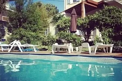 Image de À pied de la plage de cette villa de 3 chambres avec piscine privée et jardin