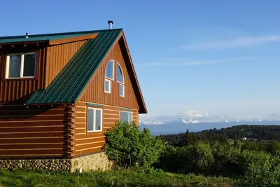 Image de Cabane en rondins personnalisée avec une vue imprenable - idéale pour les couples et les familles!