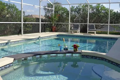Image de 4ch\/3sdb (2 suites) piscine avec bar, jacuzzi, proche Disney, terrasse couverte