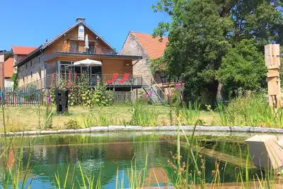 Image de « Source » Brauhaus 3 pour les couples / célibataires / amis, avec cheminée et un bain à remous extérieur