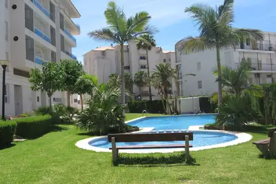 Image de First line beach apartment with large terrace, communal pool and garage