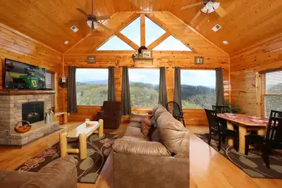 Image de Cabine avec vue imprenable sur la montagne Arcade, piscine et bain à remous sur table