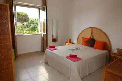Image de Villa delle Boungaville à 700 mètres de la mer - tranquillité maximale entourée par la verd