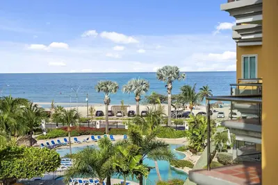 Image de Beachfront - Eagle Beach - Oceania Resort - Coral Luxury condo de deux chambres - E423