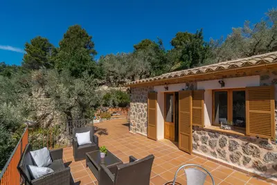 Image de Es Coll D'En Pastor - Beautiful stone house with spacious terraces amidst the mountains. F