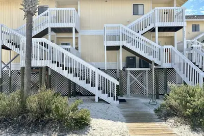 Image de Vous ne pouvez pas vous rapprocher de la plage sans vous mouiller!