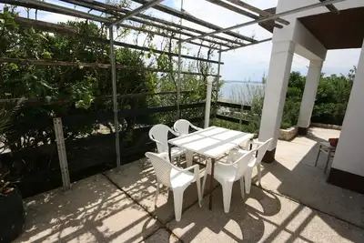 Image de Appartement d'une chambre avec la terrasse et la vue sur le mer Baie Smokvica, Pag (A-6314-a)
