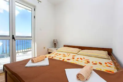 Image de Appartement de deux chambres avec le balcon et la vue sur le mer Baska Voda, Makarska (A-6761-c)