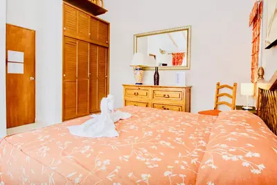 Image de Chambre Confort Exécutive Avec Piscine Climatisation Et Parking