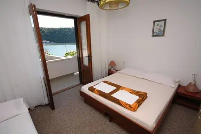 Image de Appartement de quatre chambres avec la terrasse et la vue sur le mer Kampor, Rab (A-5051-a)