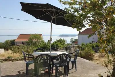 Image de Appartement de deux chambres avec la terrasse et la vue sur le mer Savar, Dugi otok (A-8127-a)