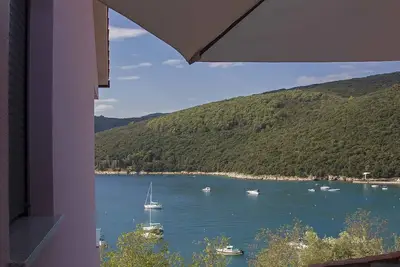 Image de Appartement de vacances avec air conditionné et vue sur la mer