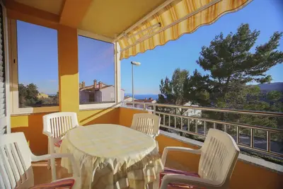 Image de Appartement de vacances avec joli balcon, climatisation et place de parking