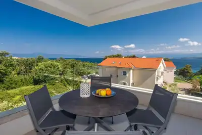 Image de Appartement de vacances avec climatisation et vue sur la mer